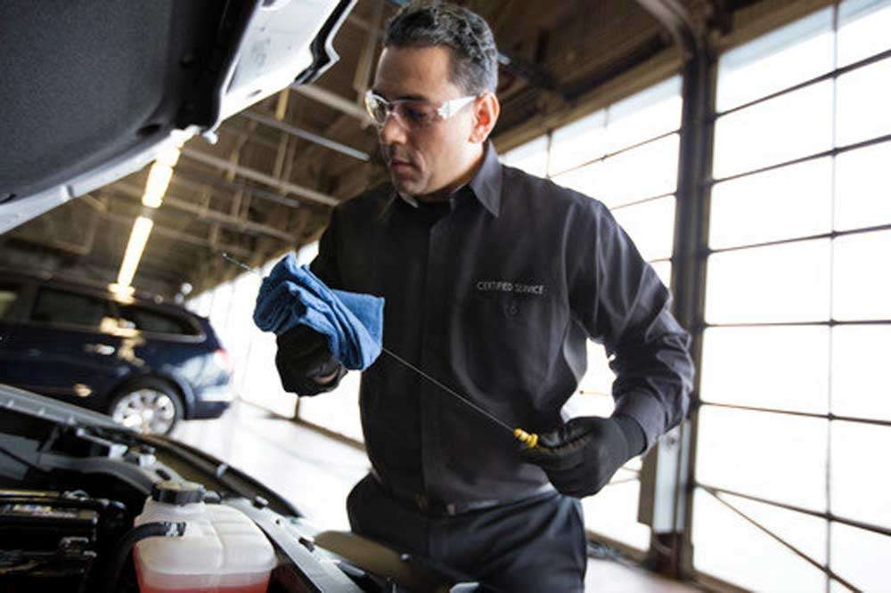 technician checking Oil